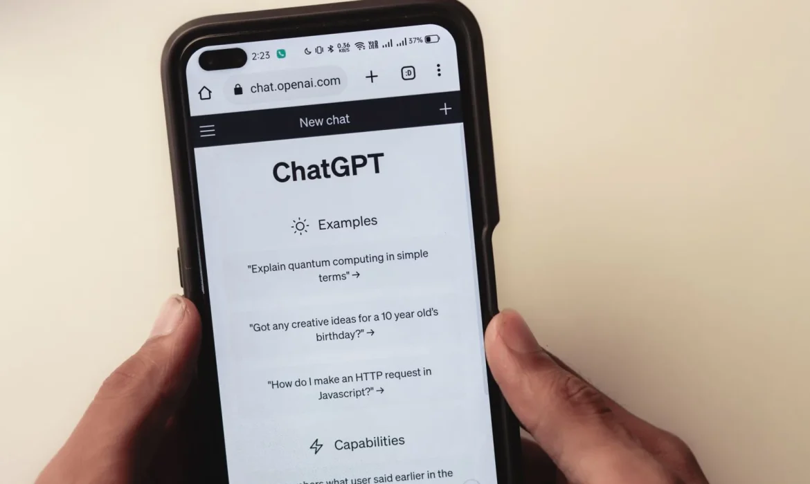 Hand holding a phone showing ChatGPT, illustrating GEO (generative engine optimization) vs SEO