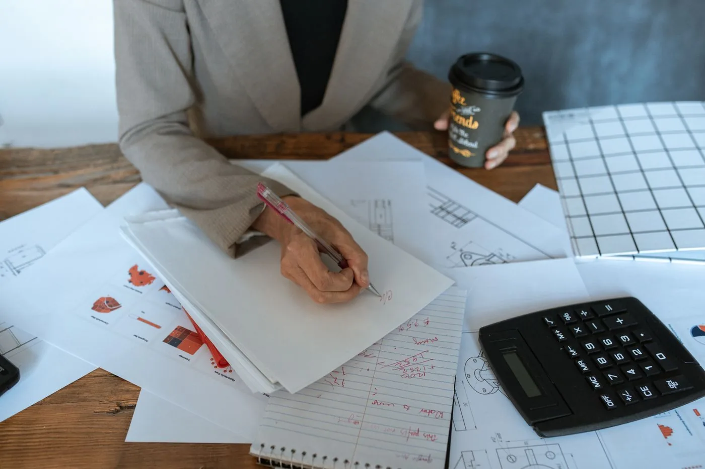 Content writer creating SEO-optimized article with keyword research displayed
