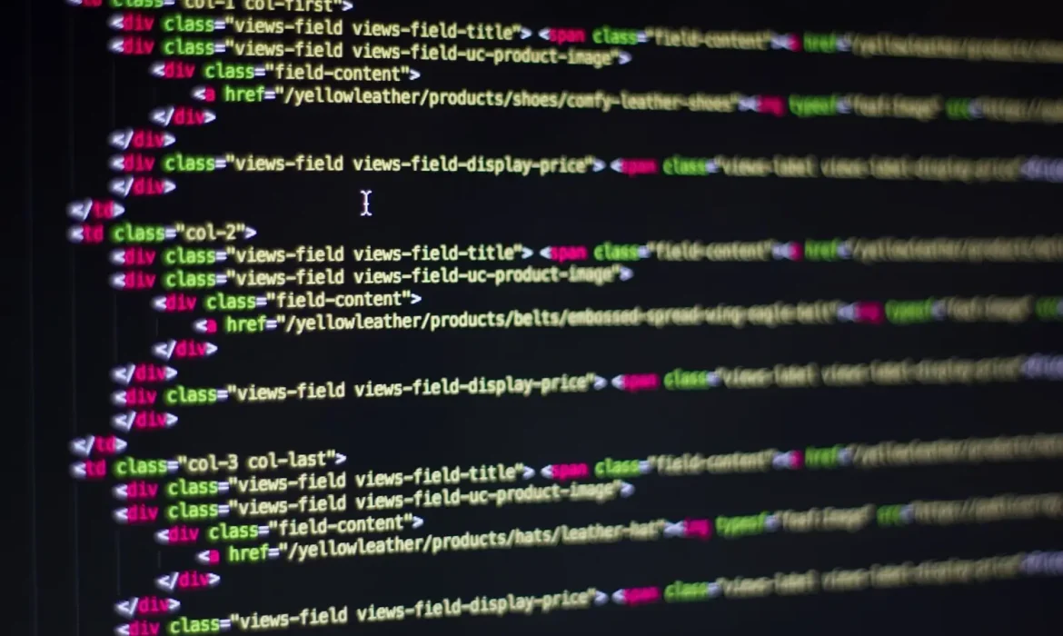 Web developer working on website code on a screen