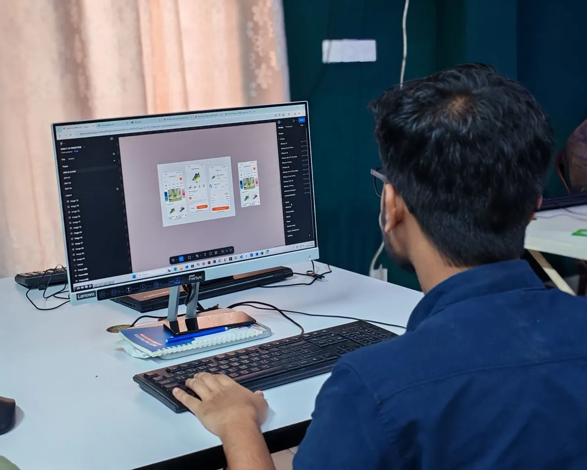 Web designer building a responsive interface layout on screen