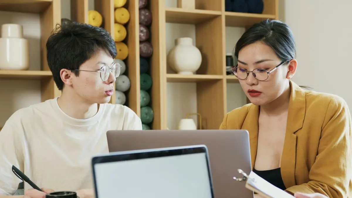 An SEO consultant meeting a Singapore small business owner on their own premises