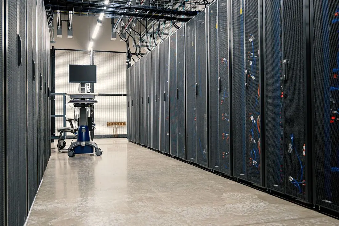 A row of server racks in a data centre aisle
